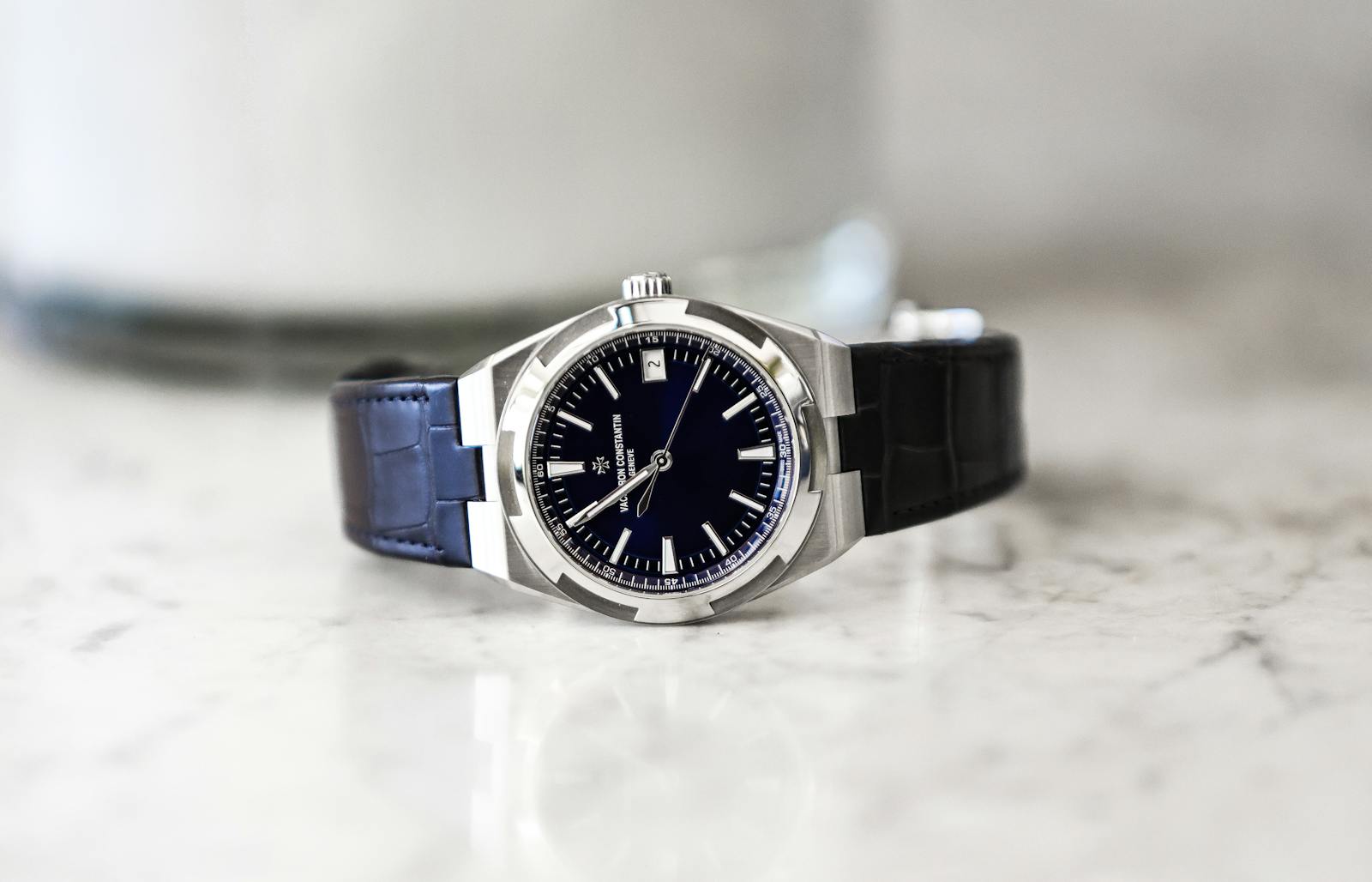 High-end wristwatch on a bright surface representing careful order verification