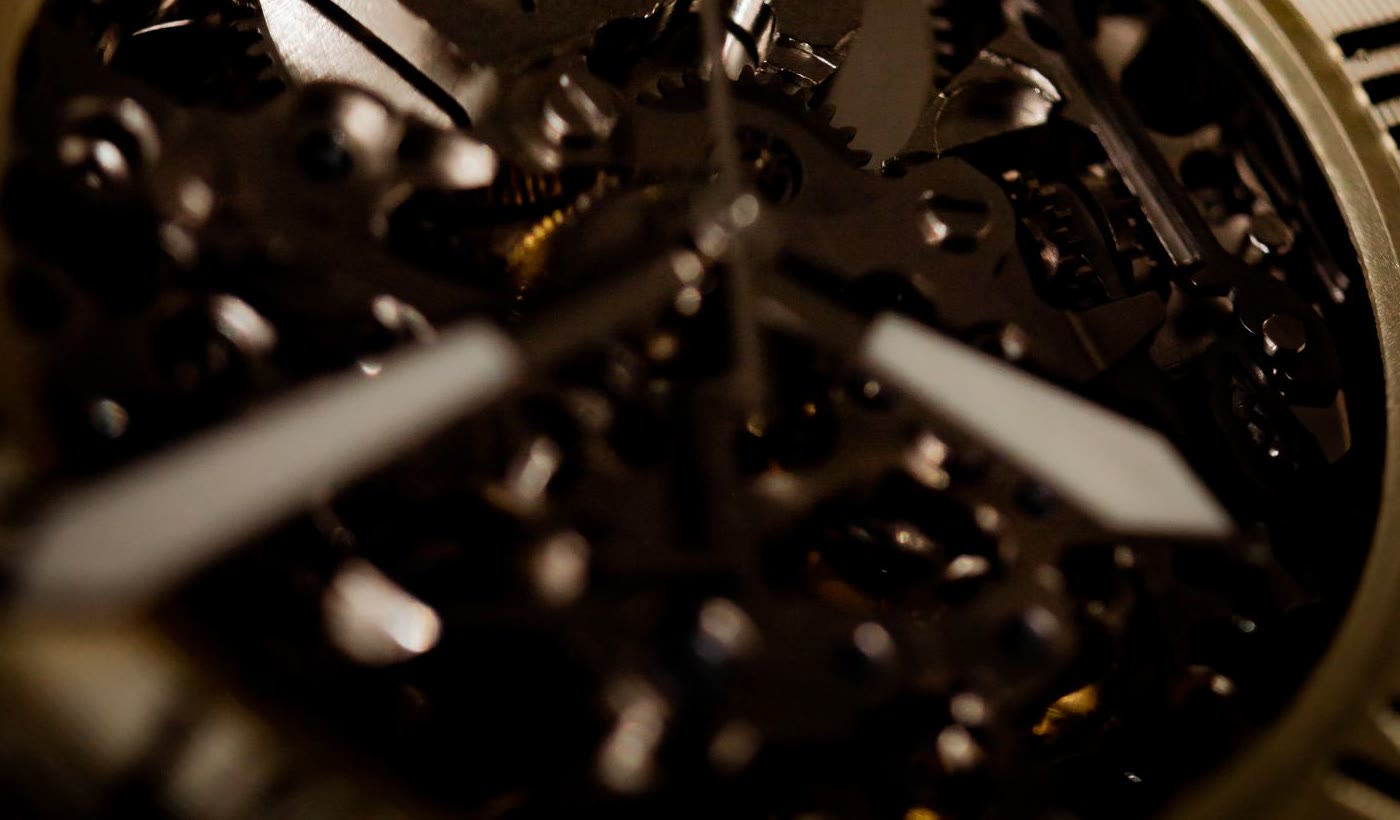 Close detail of mechanical watch components under inspection